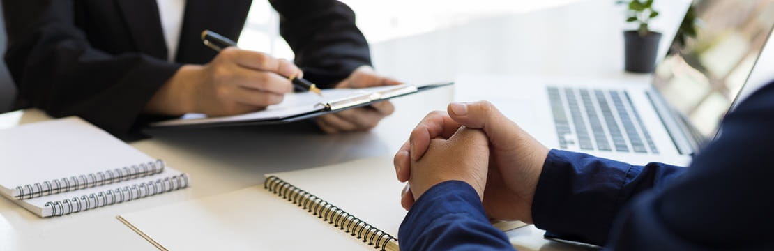 Business owner conducting an exit interview with an employee.
